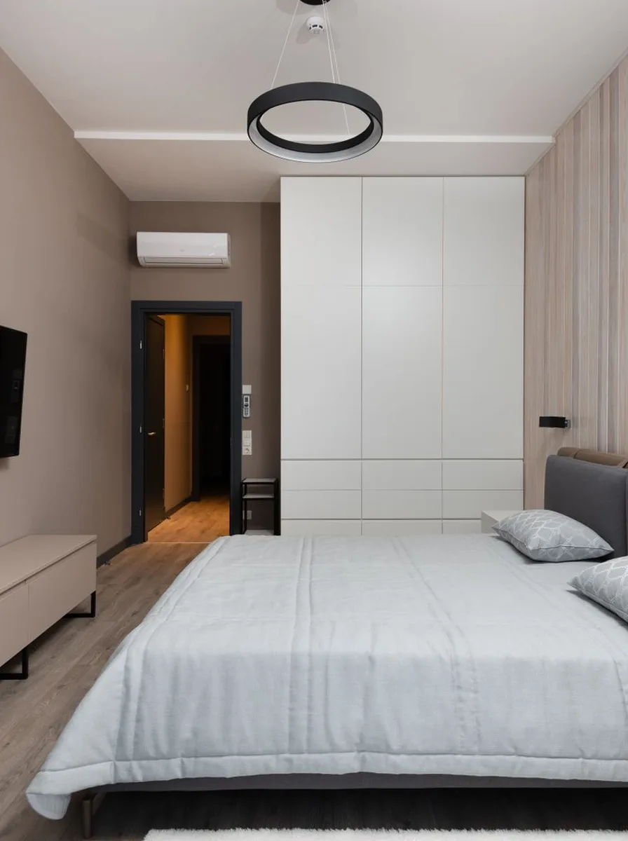 Minimalist bedroom with a simple desk corner