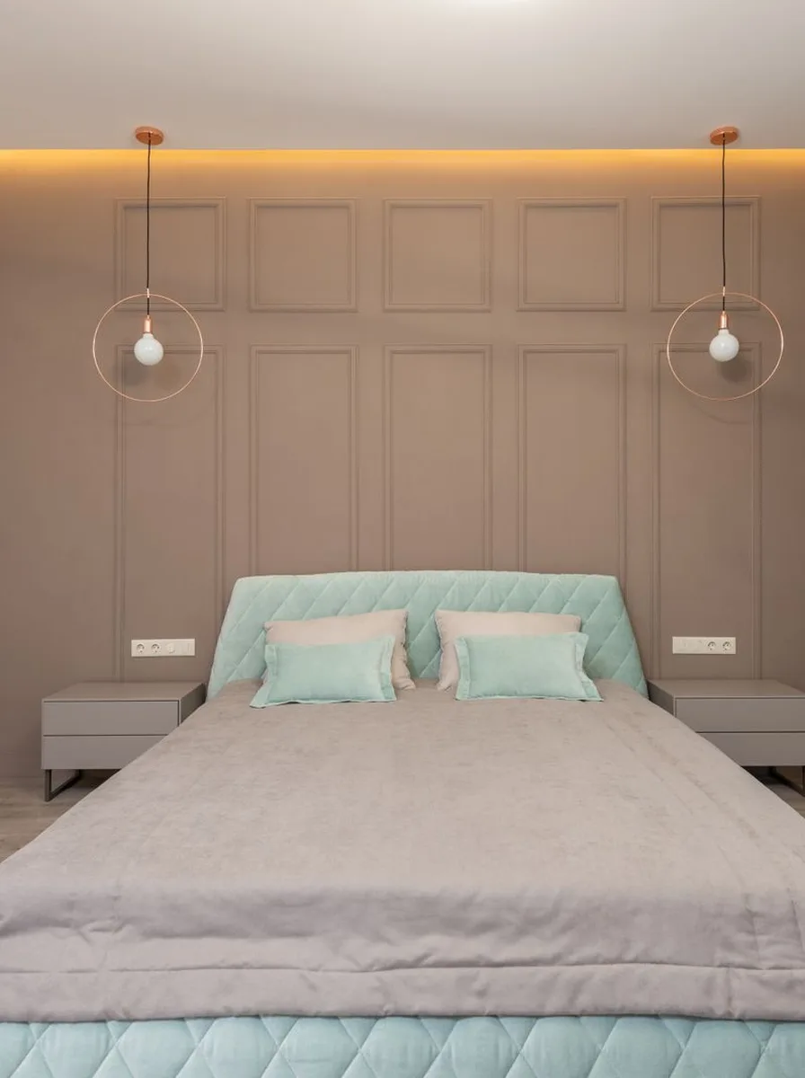 Minimalist bedroom with soft teal bedding accents