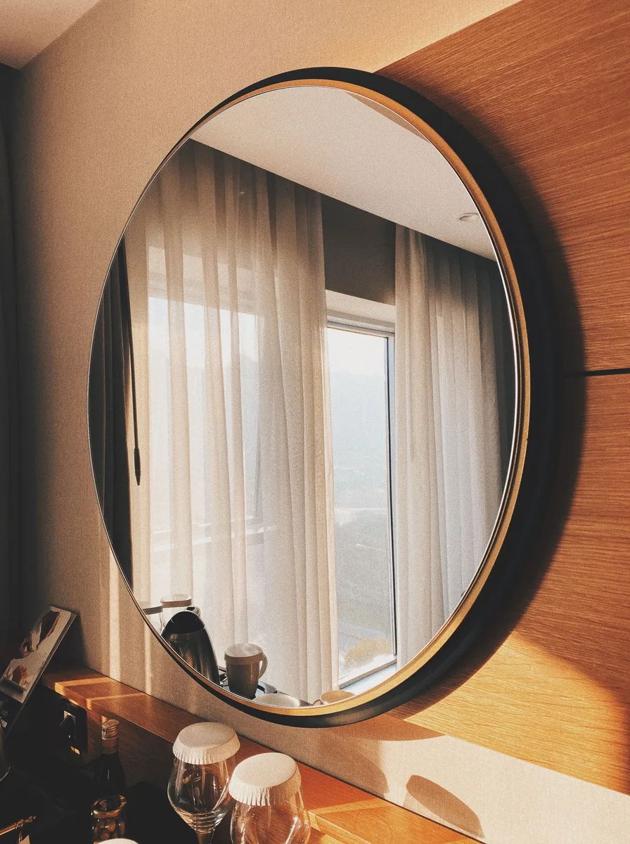 Minimalist nightstand holding only a lamp and book