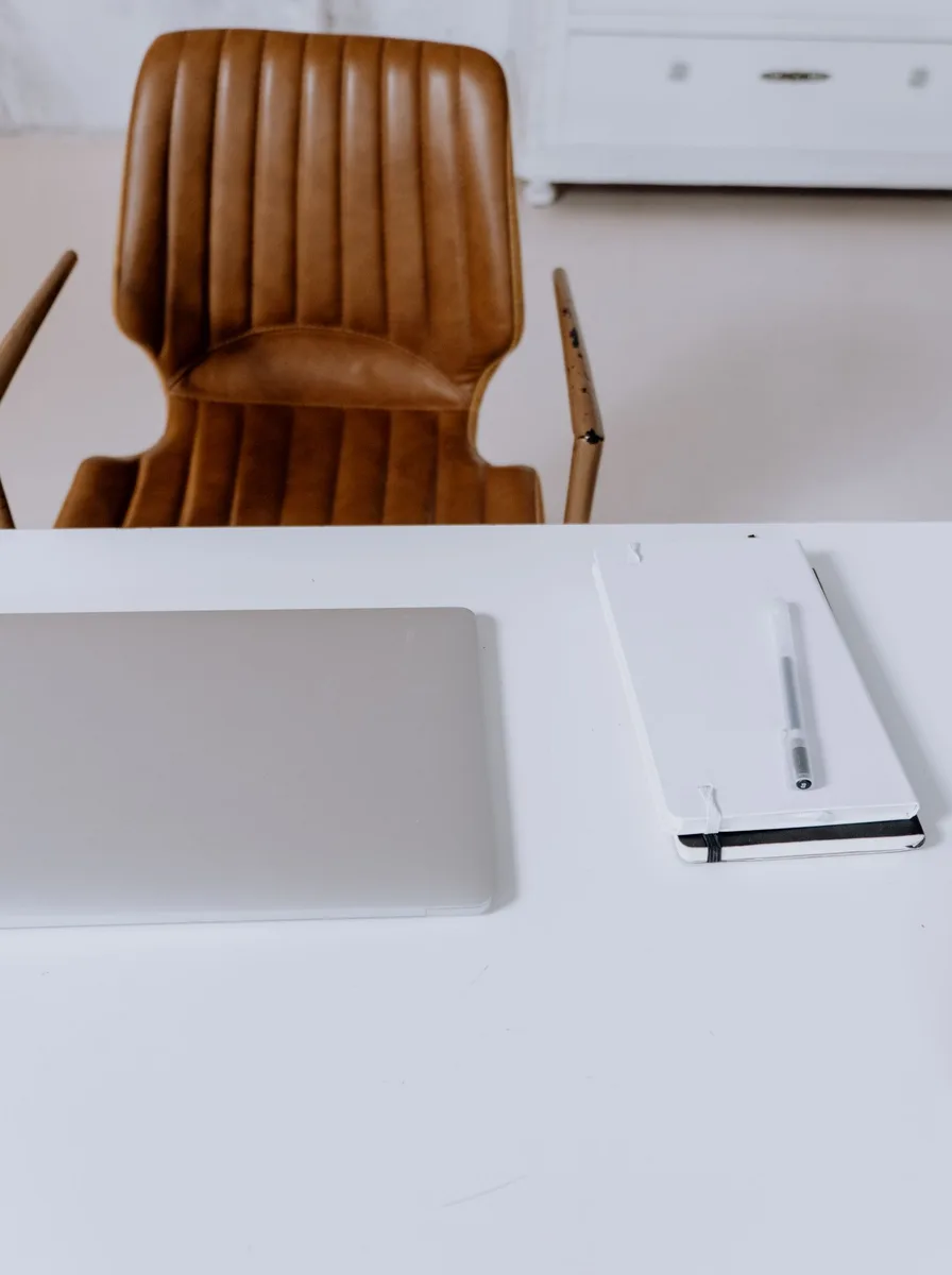 Colourful modern desk chair paired with a minimalist white desk