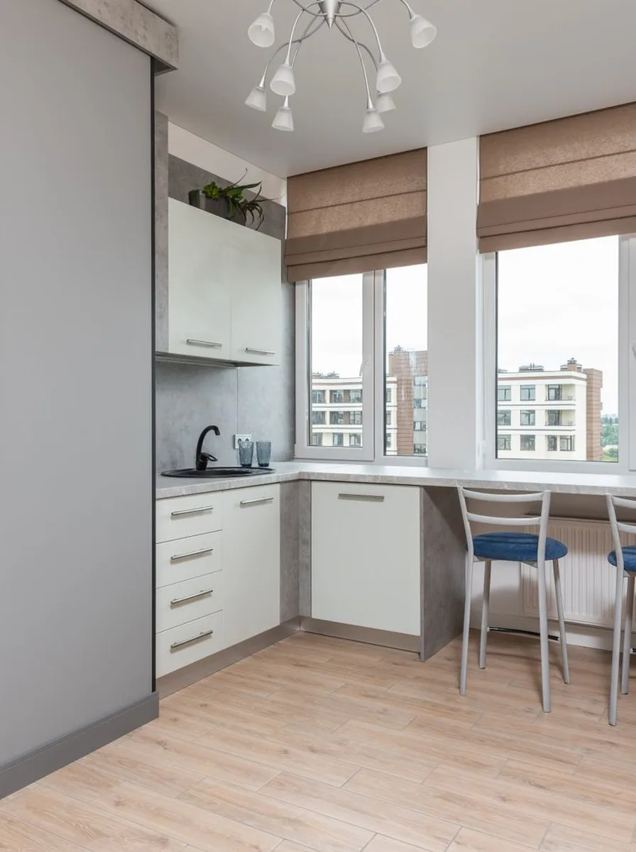 Add a Window Seat Beneath Wide Glass — modern luxury kitchen with large windows