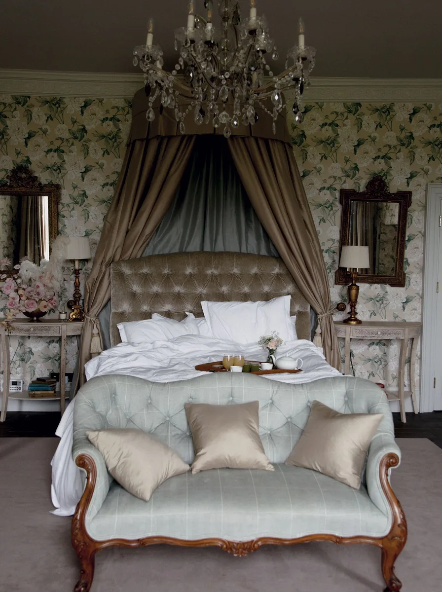 Ornate canopy bed with chandelier