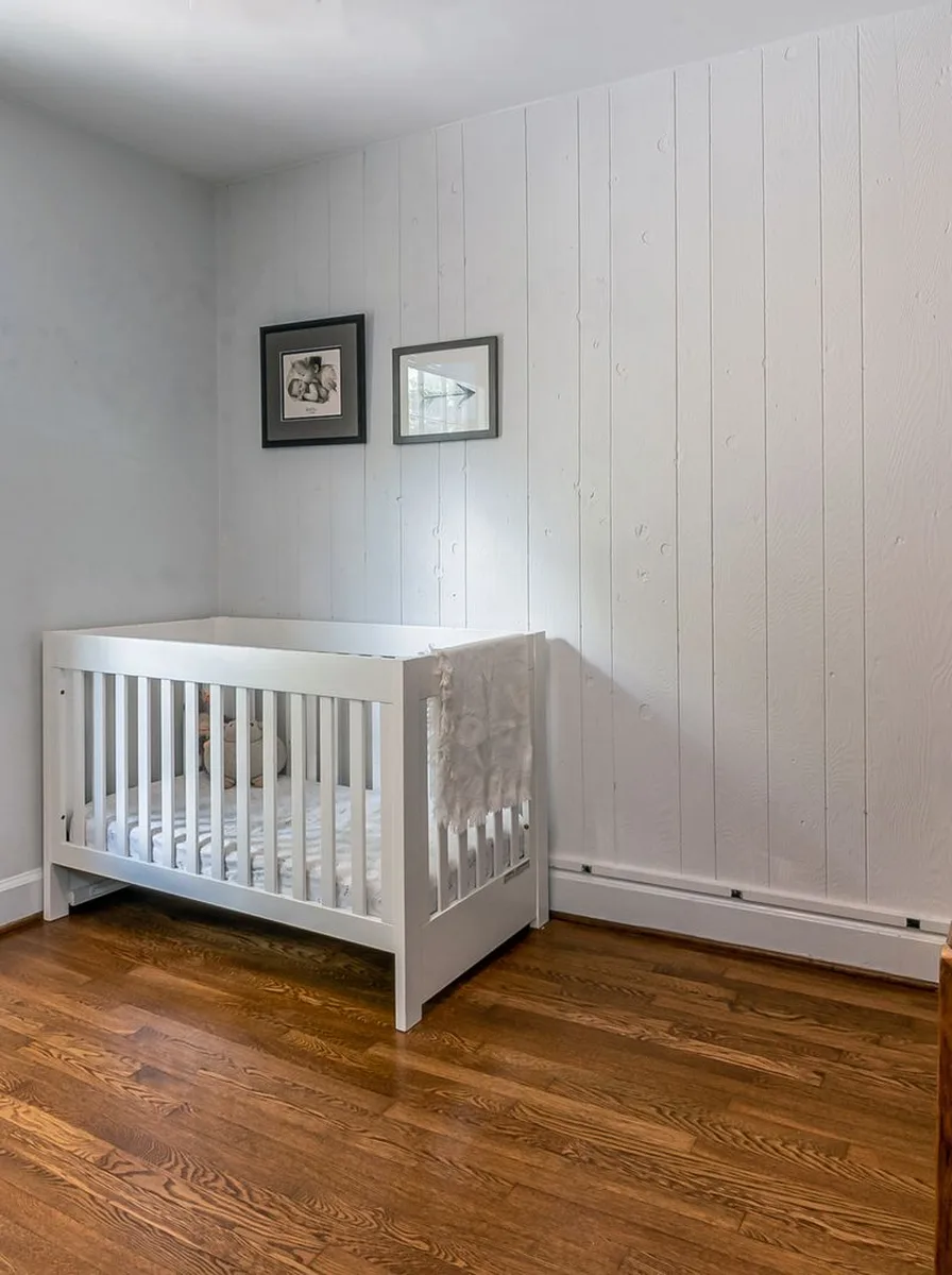 Paint swatches tested on nursery wall in natural daylight