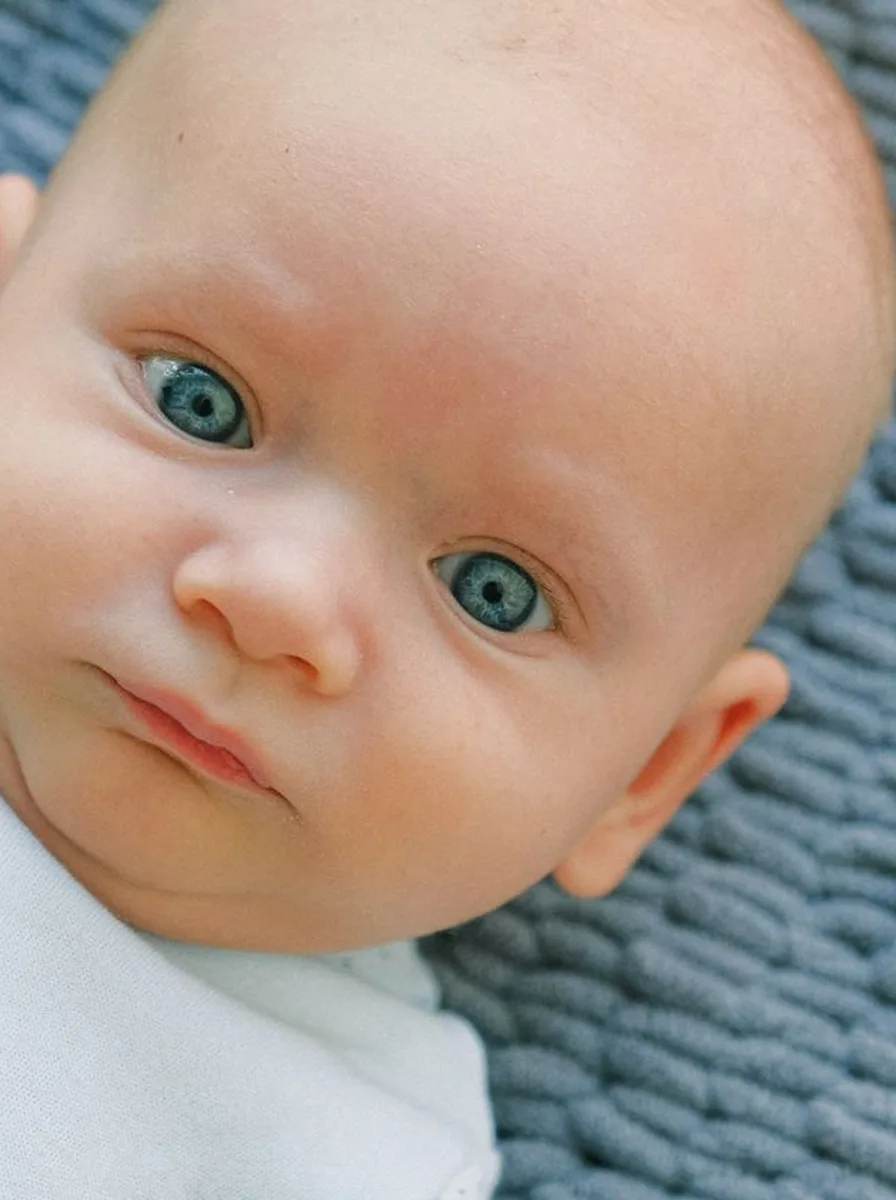 Close-up of a baby with blue eyes