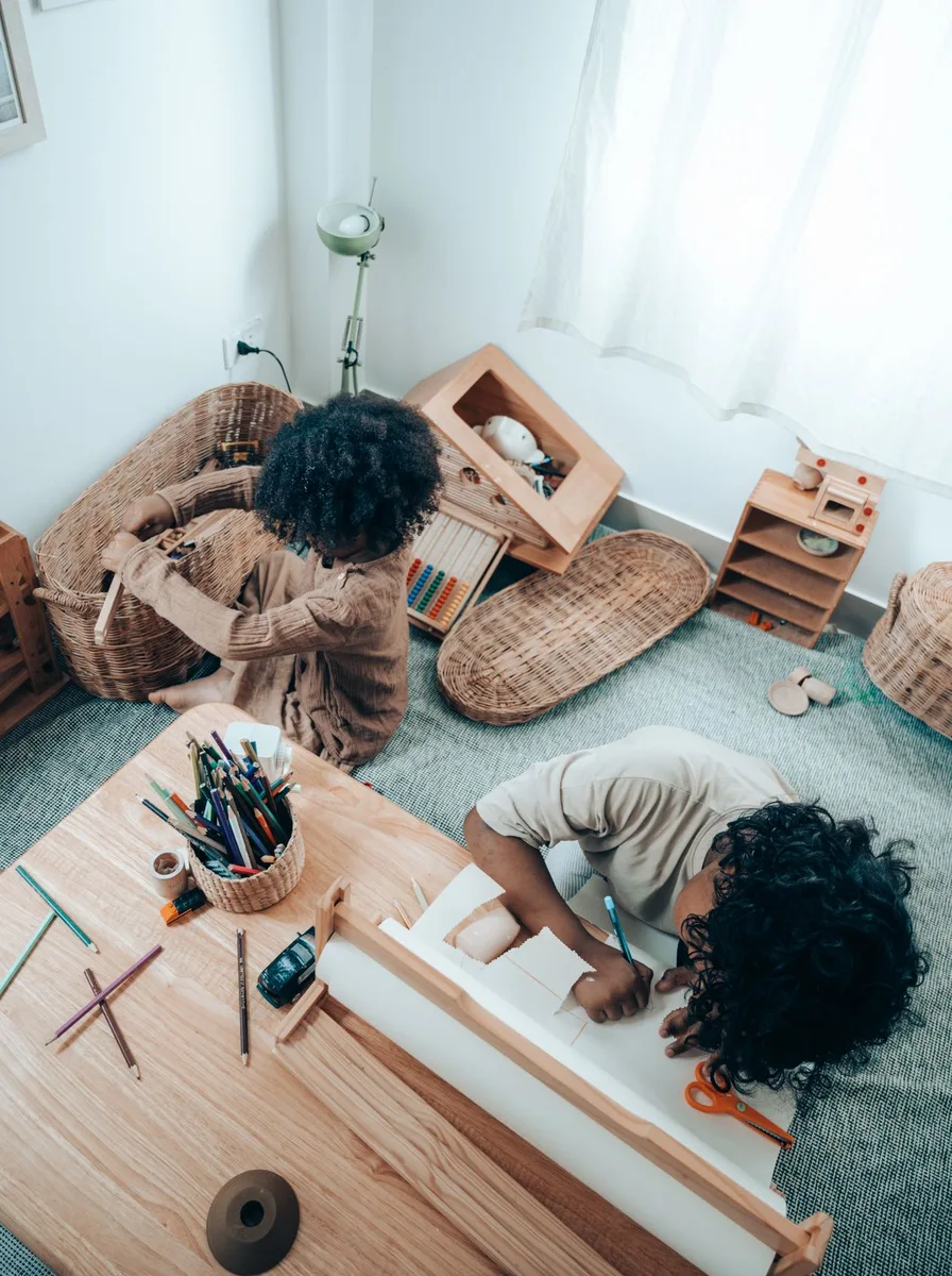 Children drawing at a table
