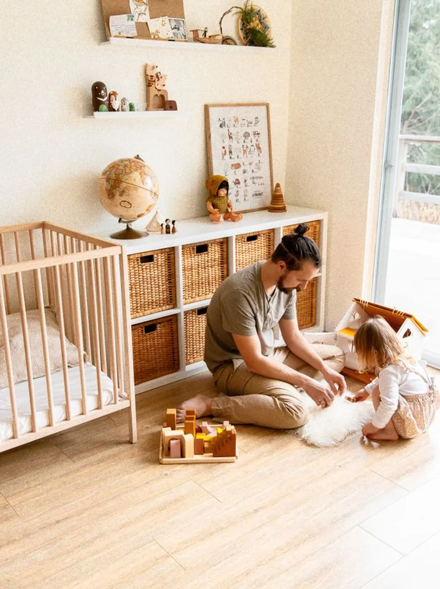 Father playing with a child on the floor