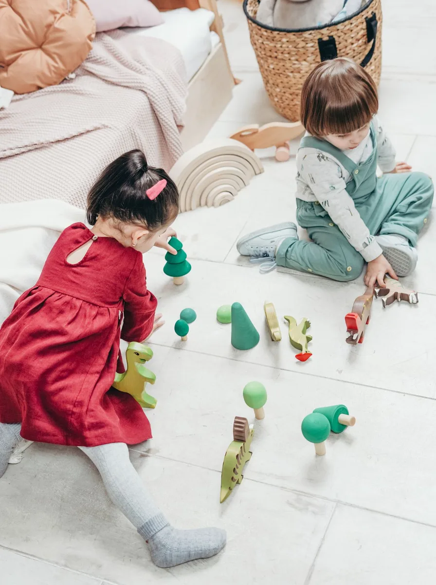 Children playing with toys on the floor