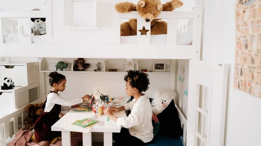 Child drawing at a desk in a creative nursery