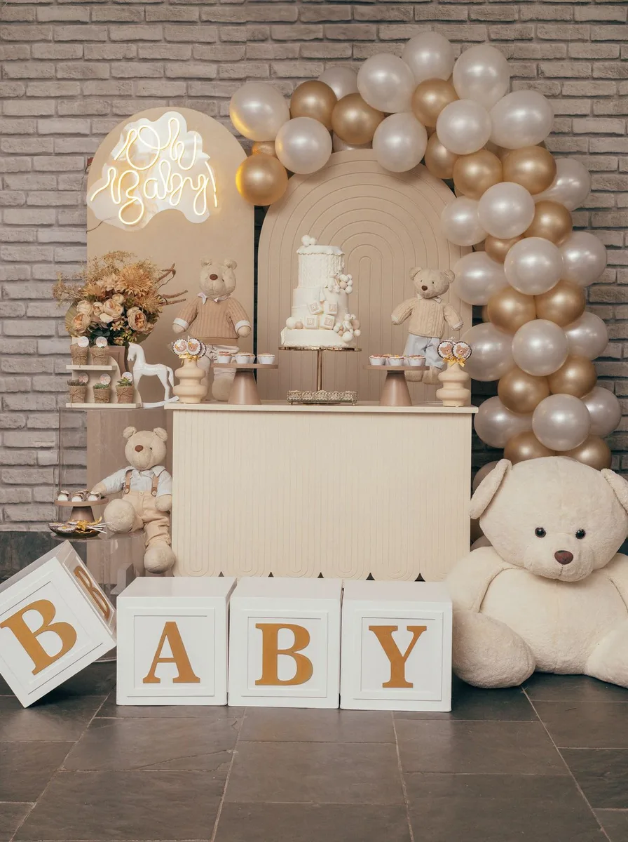 Wooden blocks spelling BABY at a party