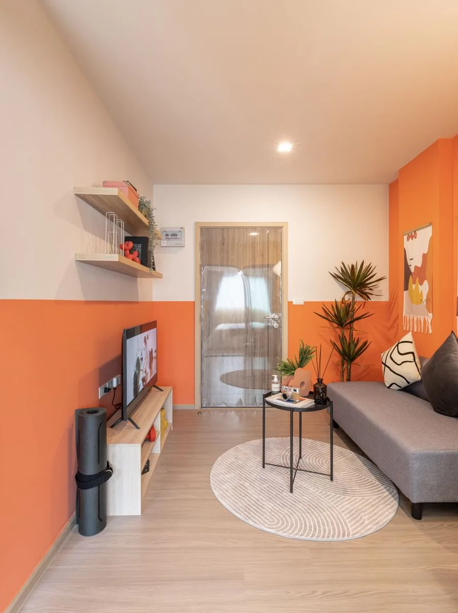Clear acrylic coffee table in tiny bright living room