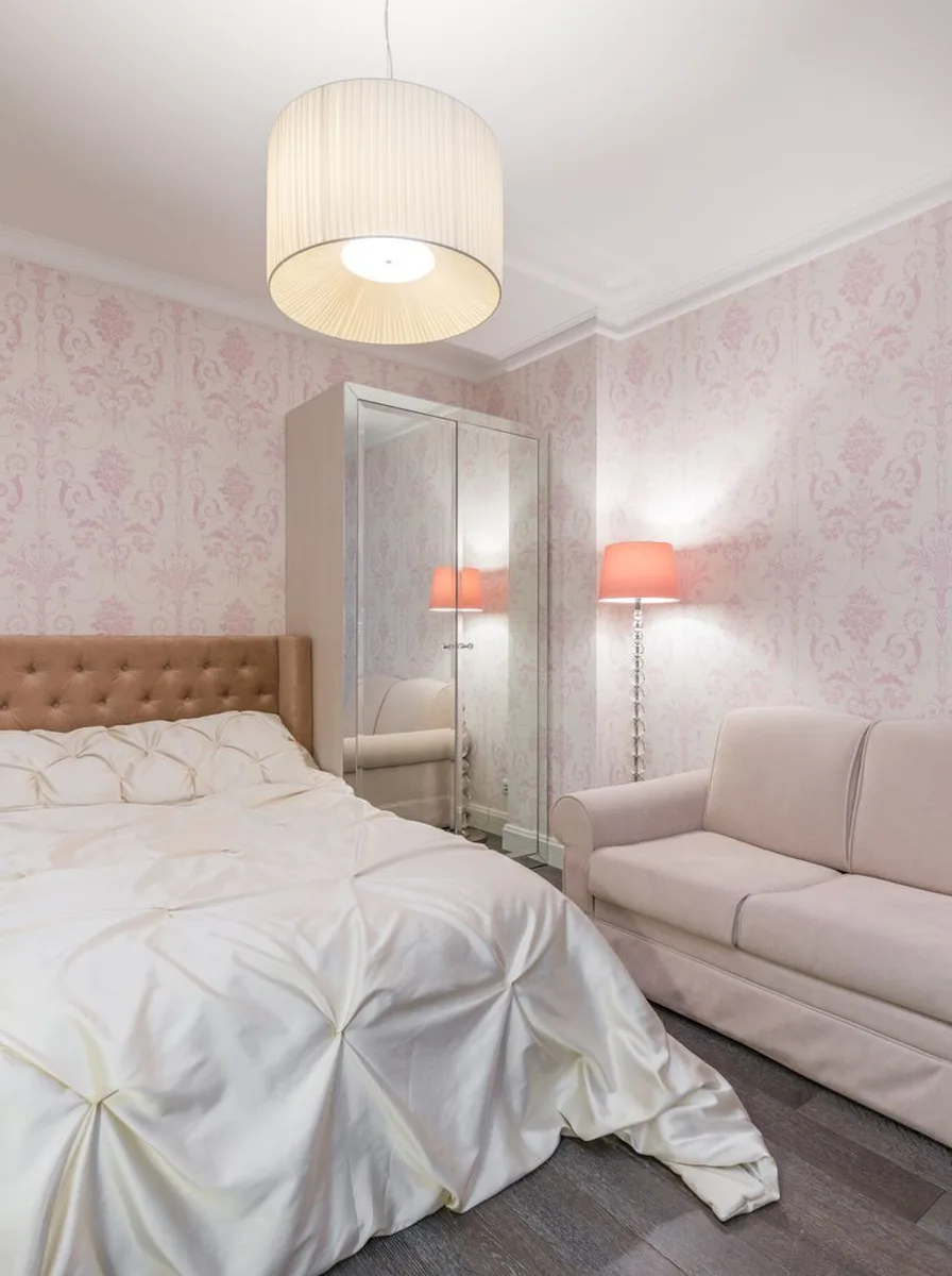 Small bedroom in soft pink tones that feel open
