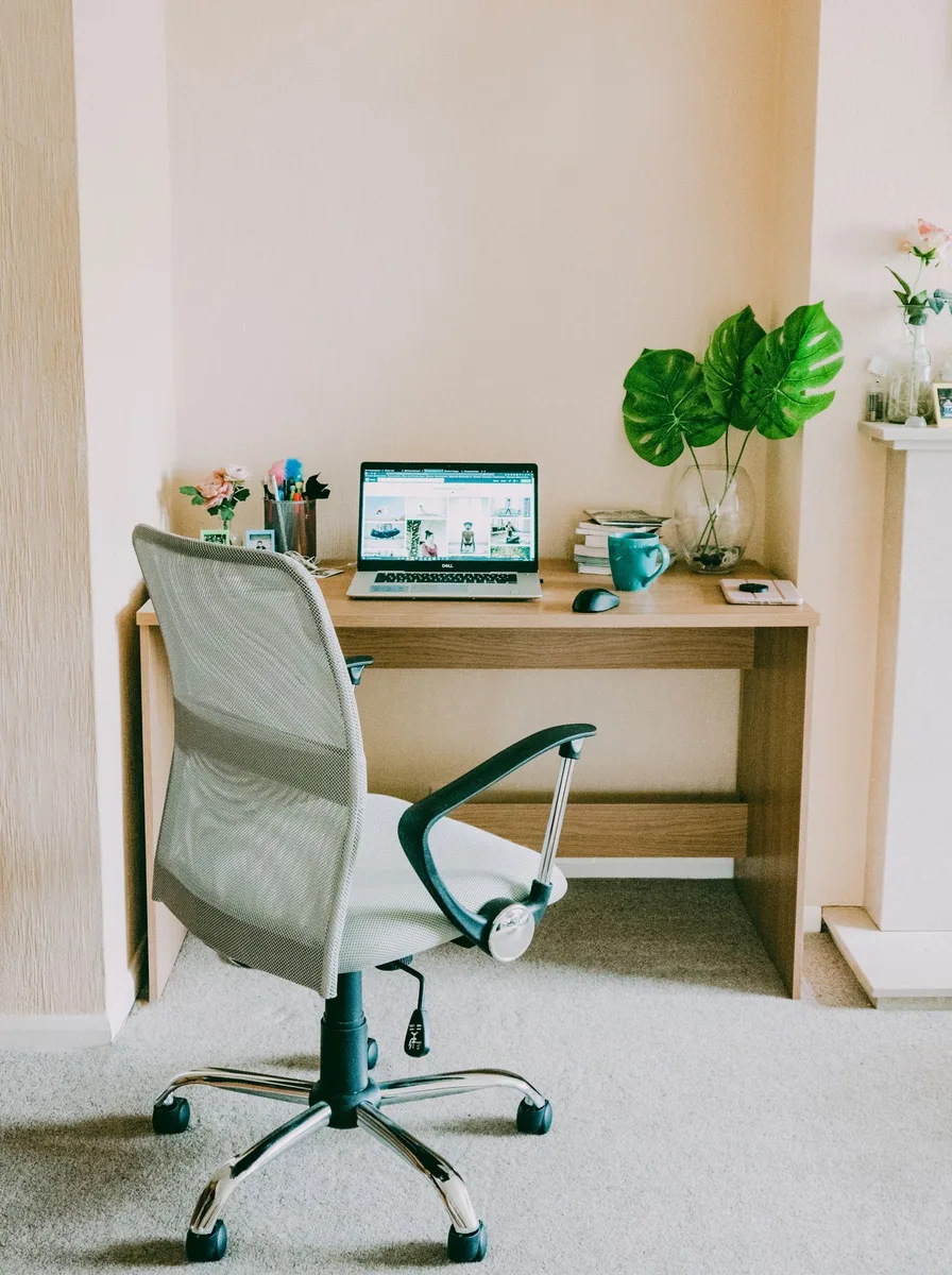 Small desk chair styled to blend into a cosy bedroom workspace