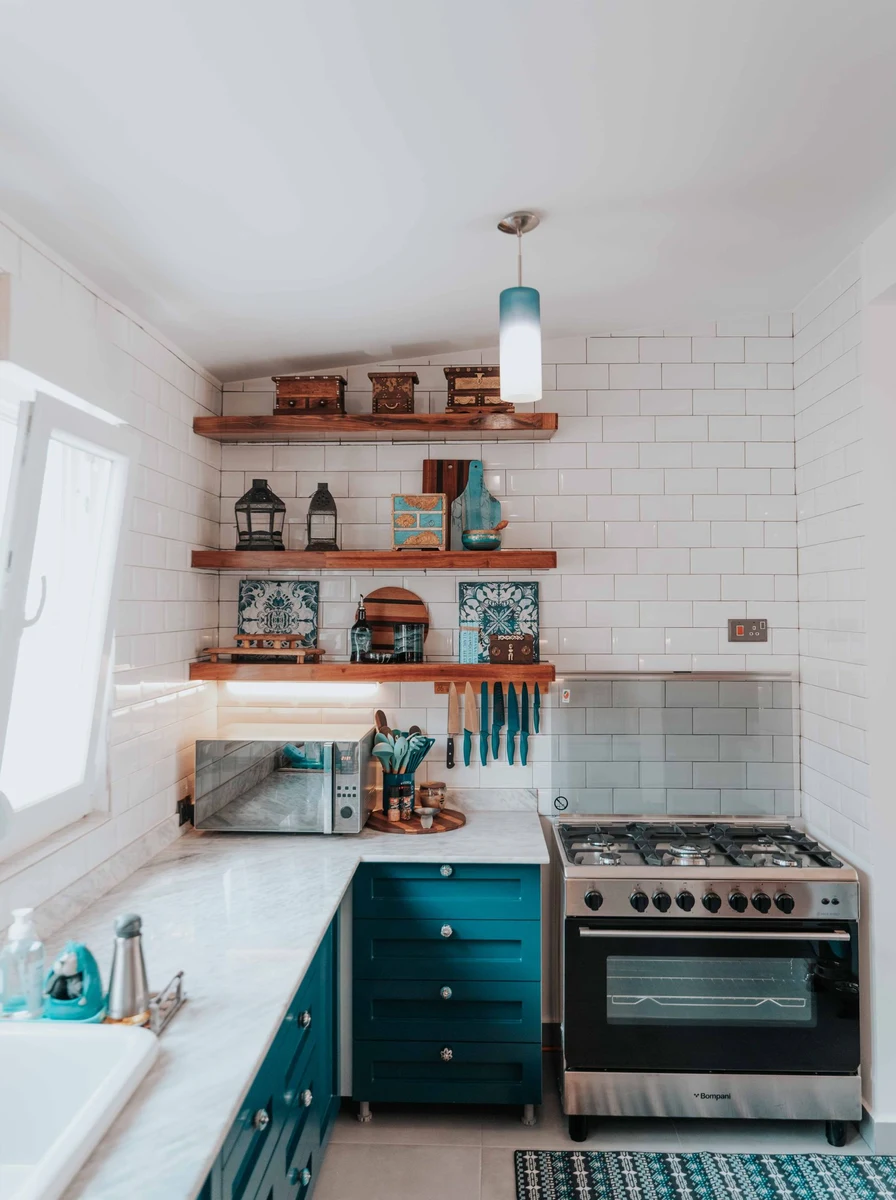 Small kitchen window with sheer curtains letting in light