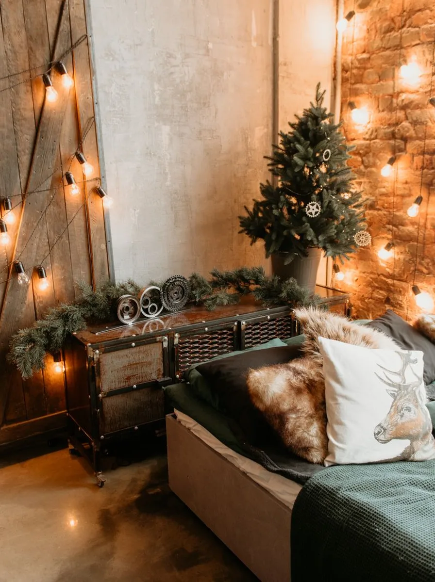 Sofa with string lights and a Christmas tree