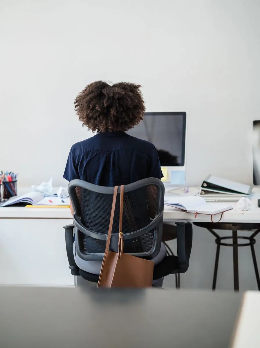 Office chair beside a desk with a laptop