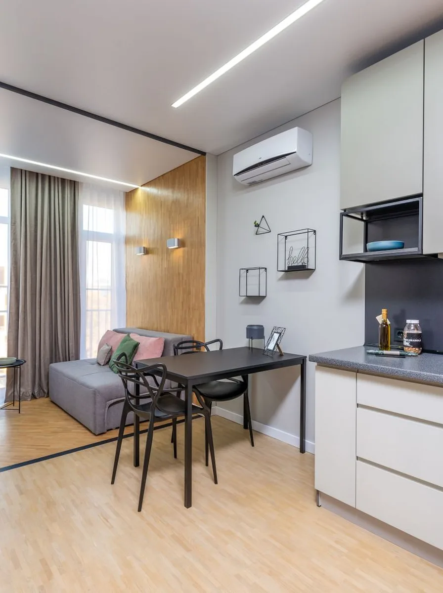 Tiny apartment with walls trim and ceiling painted one white