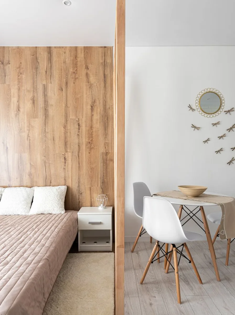 Low-profile pale sofa keeping tiny room feeling open