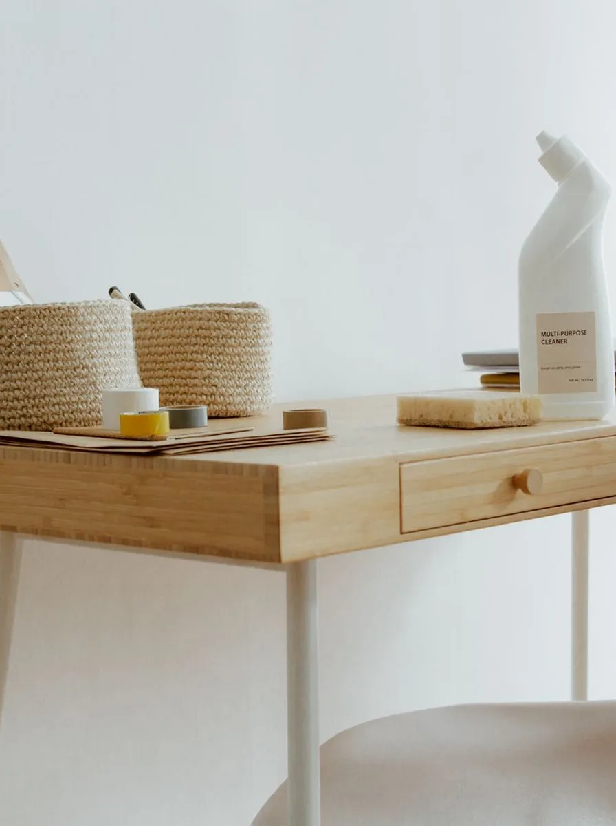 Woven baskets with kraft labels on bedroom shelf