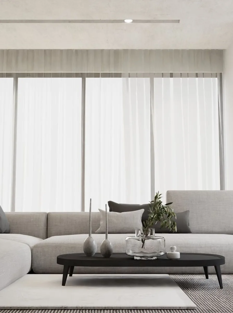 Floor-length curtains hung from ceiling in tiny room