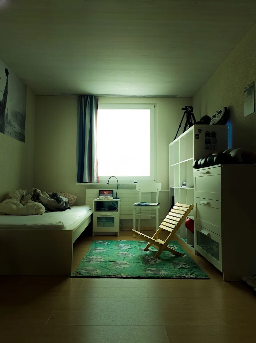 Interior door painted deep green in tiny apartment