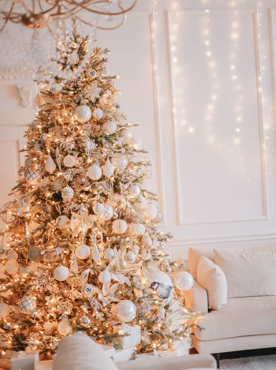 White and gold Christmas tree with fairy lights