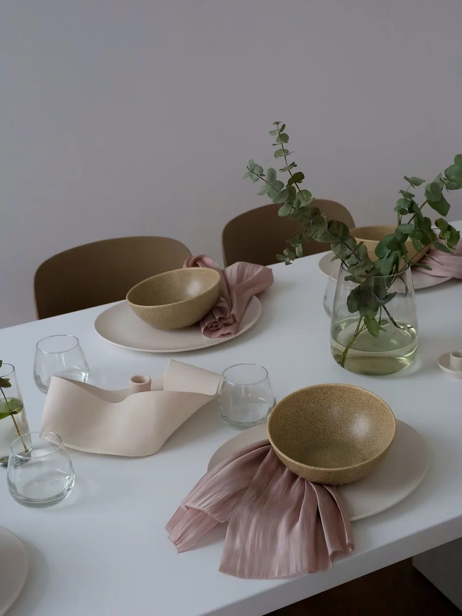Low dish garden of succulents on a dining table