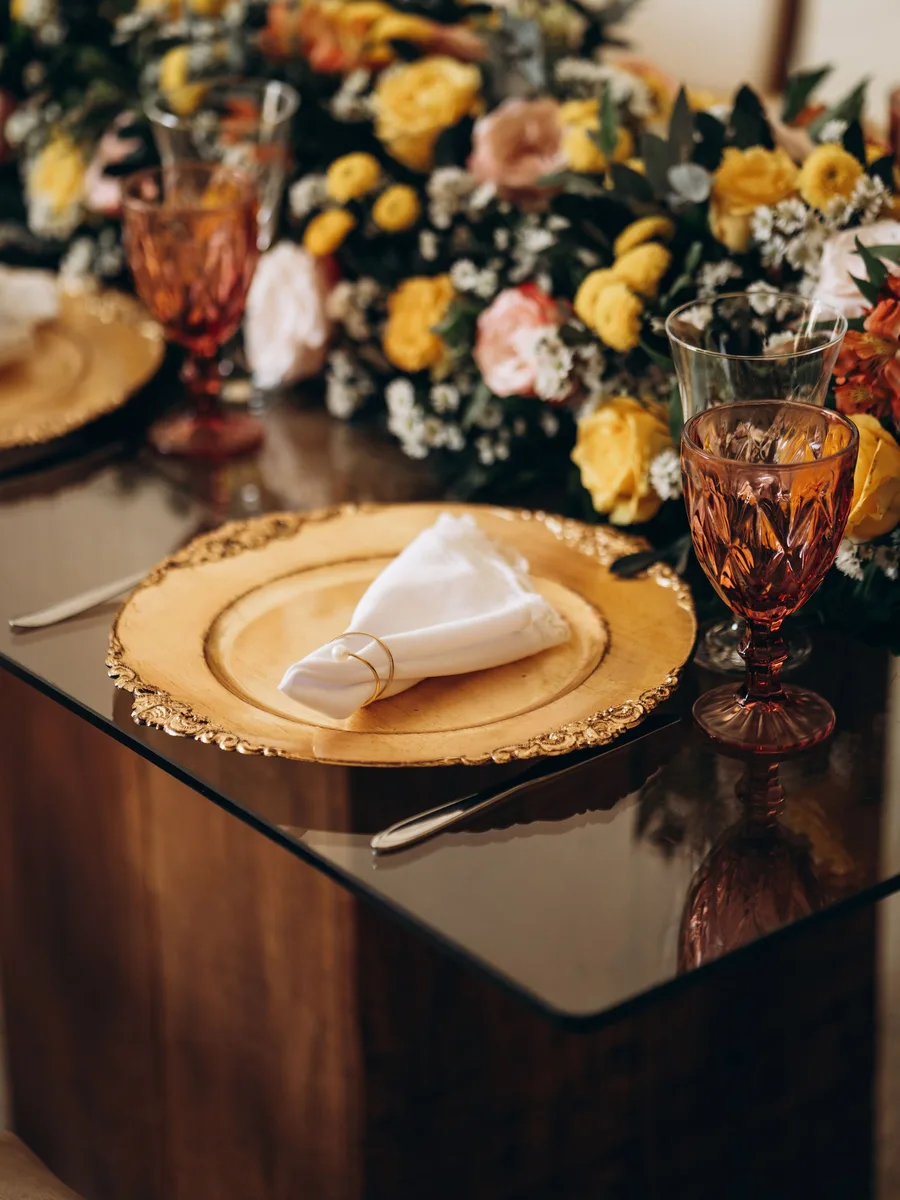 Burlap runner with pinecones and candles on a dining table