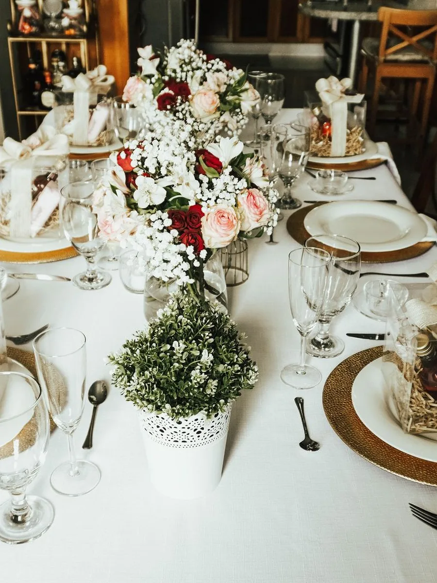 Mason jars of wildflowers on a dining table