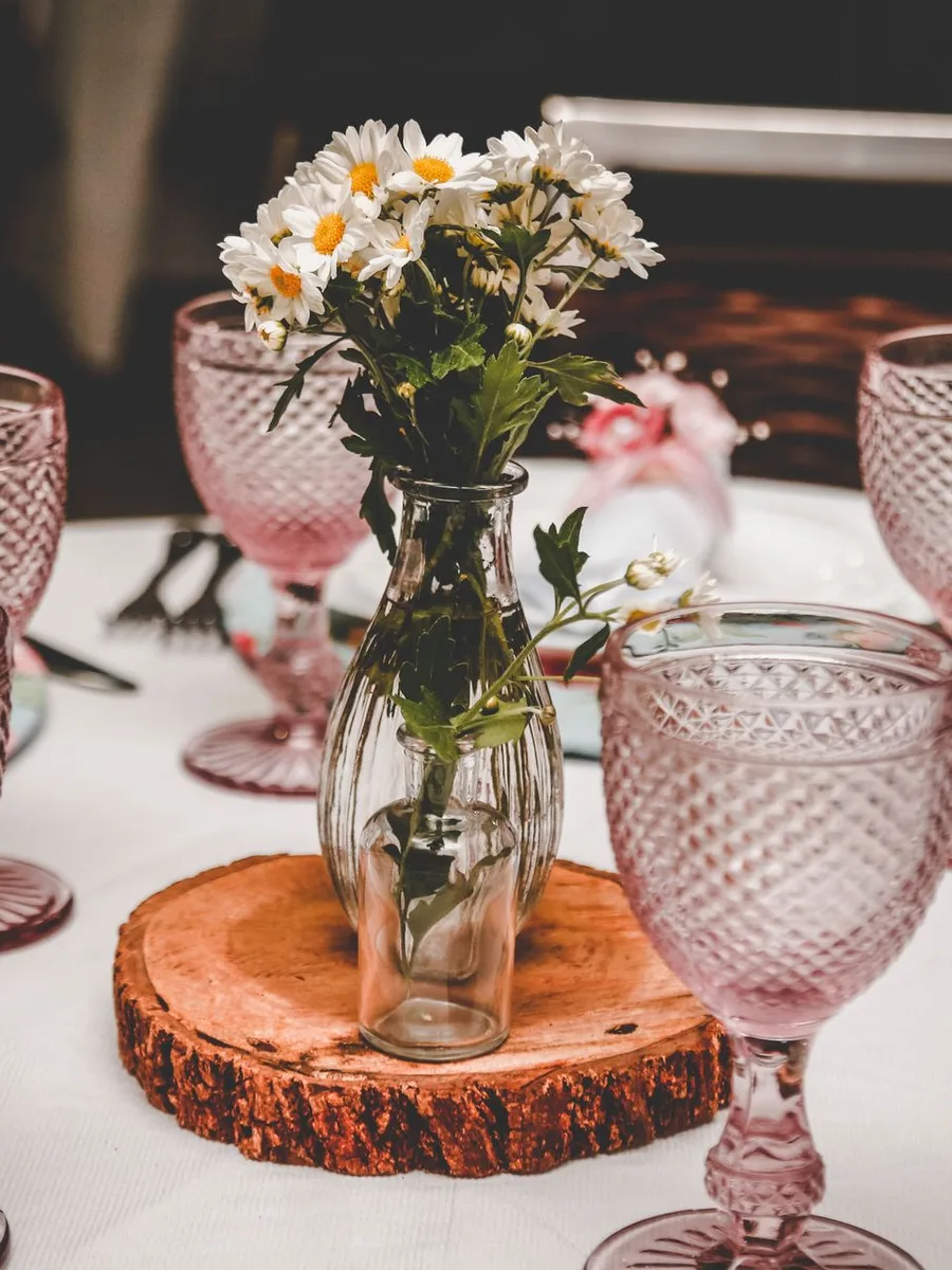 Tall vase of pampas grass plumes on a dining table